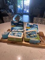 Full lot showing two complete lunchbox kits with bags, boxes, bands and ice packs