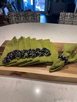 All napkins stacked with napkin rings displayed