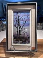 Full view framed painted tile on stand