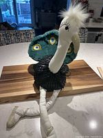 Front view showing full doll, tail, legs and shoes