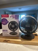 Fan with box showing front and branding