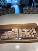 Both Stampin’ Up! French stamp sets in clear cases on table