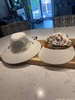 Both hats side by side on countertop