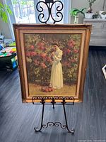 Full front view of framed canvas on easel
