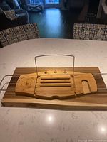 Full view of bamboo caddy with book stand raised and arms retracted