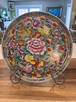 Full view of floral porcelain plate on stand