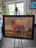 front view of framed Man O’ War print on stand