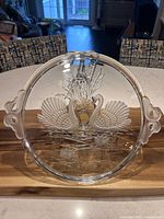 Top view showing twin swan motif, frosted handles and lily pads