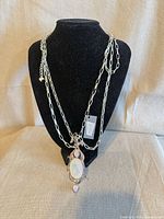 Front view showing double-strand chain and pendant