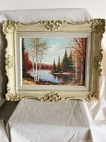 Front view of framed painting showing full artwork and ornate frame