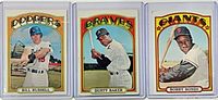 Group shot of the three sleeved cards: Bill Russell, Dusty Baker, Bobby Bonds