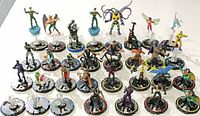 Overhead view of all 28 HeroClix bases and figurines