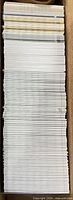 Box holding large stack of trading cards