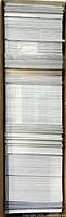Top-down view of cardboard box filled with trading cards