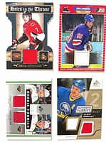 All four hockey jersey cards laid out