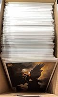 Top view of short box showing multiple bagged and boarded comics