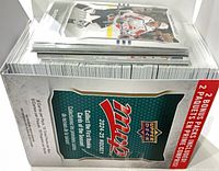 Open MVP retail box filled with stacked hockey cards, some top cards visible