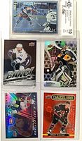 Group shot showing all five cards including slabbed Leetch and four raw inserts