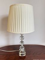 Front view showing full lamp with shade, cord visible