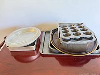 stacked assortment of pans showing variety