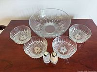 Front view of large bowl, four small bowls, salt & pepper shakers