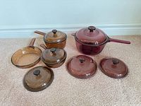 Full view of all cookware pieces and lids