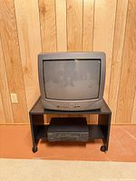 Front view of Daewoo CRT TV on stand with Hitachi VCR
