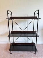 Front view showing full three-shelf structure, metal frame and X-brace