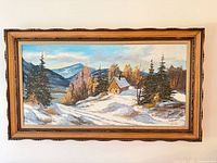 Front view of framed R. Hubert winter landscape painting