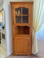 Full view of corner cabinet front, doors closed