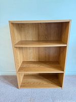 Front view of light oak 3-shelf bookcase