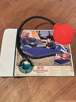 Box showing Ozark Trail double air bed and red bellows pump