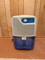 Front view of Simplicity dehumidifier with blue tank installed