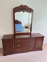 dresser with attached mirror full view