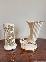 Both porcelain lamps side by side showing overall forms and gold gilt details