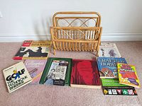 Full lot showing rattan rack and all books laid out