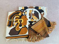 All three woven rugs/throws grouped