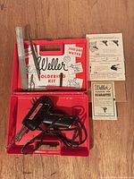 Soldering gun in case with accessories and paperwork