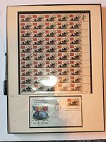 Full framed display showing entire stamp sheet and first-day cover