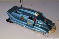 Left side view showing decals, wheels, and opened door