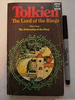 Front cover of 1970s Ballantine Books paperback with Sharpie for scale