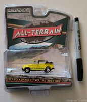 Front view of sealed GreenLight All-Terrain blister pack containing yellow 1973 Volkswagen Type 181 diecast car