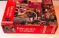 Front of sealed Coca-Cola 2000-piece puzzle box
