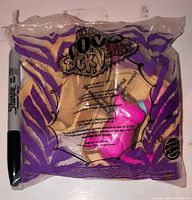 Front of sealed purple package showing movie logo and Burger King logo