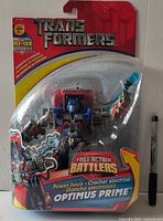 Front view of sealed Power Hook Optimus Prime figure in packaging