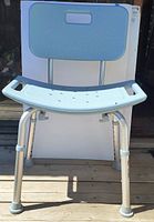 Front view of adjustable height shower chair