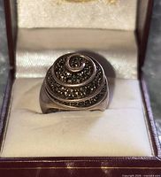 Front view of spiral sterling ring displayed in box