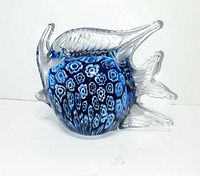 Front view of blue millefiori glass fish showing body pattern and clear fins