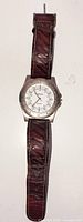 Front view of Carriage wristwatch showing dial, bezel and brown leather strap