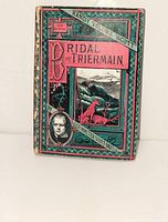 Front cover showing title, author portrait and decorative design
